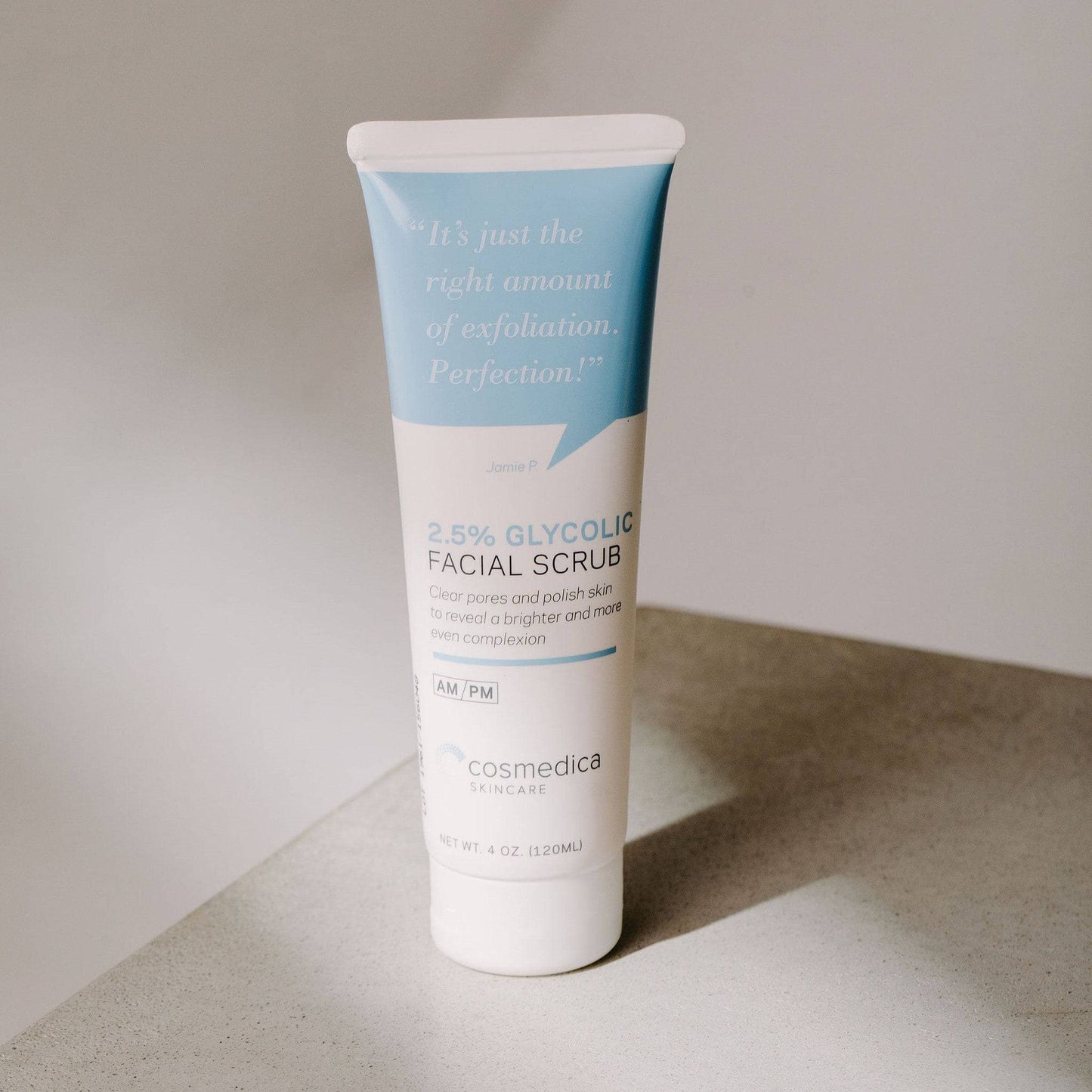 Close-up of the 2.5% Glycolic Facial Scrub from the Complete Complexion Kit by Cosmedica Skincare, showcasing its sleek tube design.