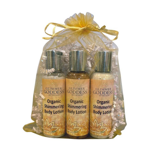 Travel size gift set of Organic Shimmer Body Lotion by GNS Beauty & Personal Care, featuring three sparkling body lotions in a decorative bag.