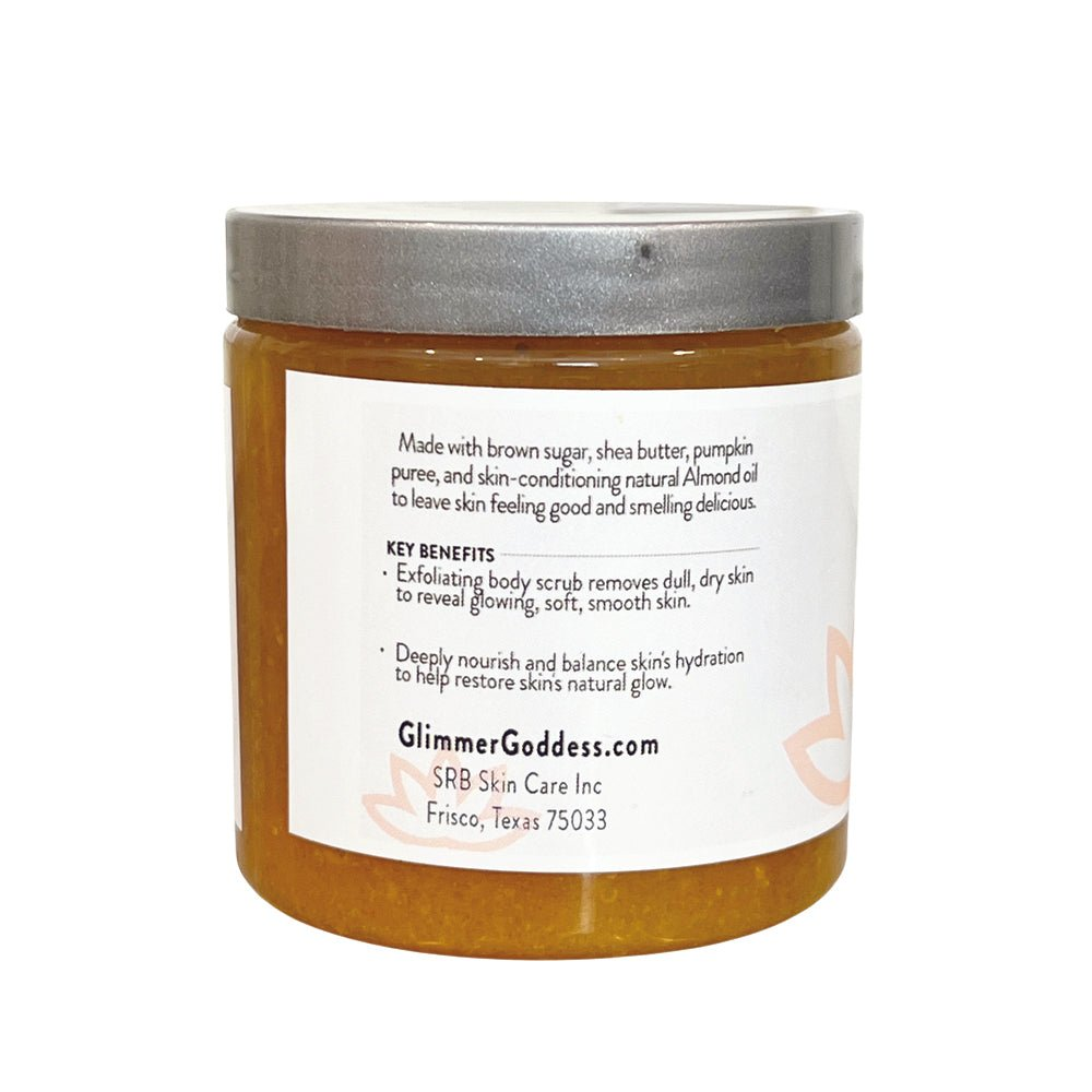 Back view of Glimmer Goddess Organic Pumpkin Shea Sugar Body Scrub jar, detailing key benefits and nourishing ingredients like pumpkin puree and almond oil.