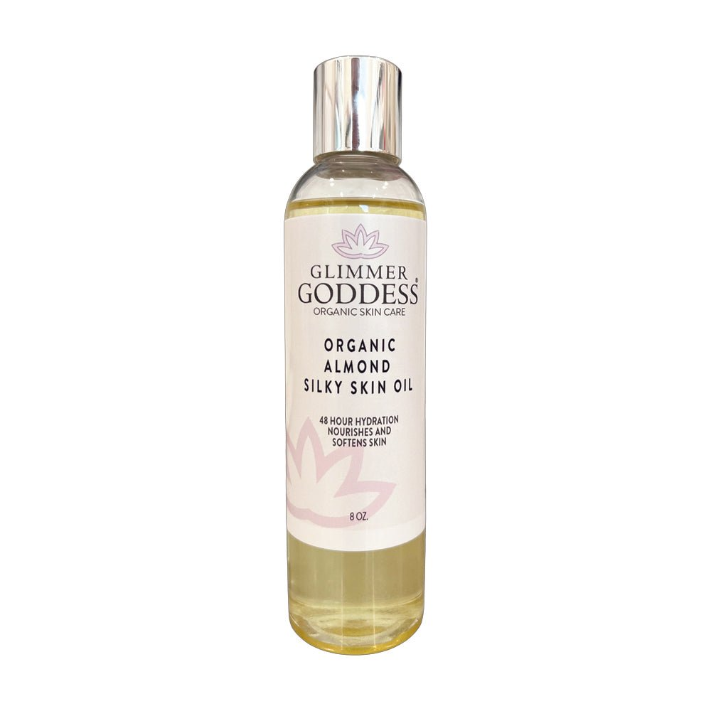 Glimmer Goddess Organic Sweet Almond Silky Skin Oil bottle on a white background, showcasing its premium packaging for 48 hour hydration.