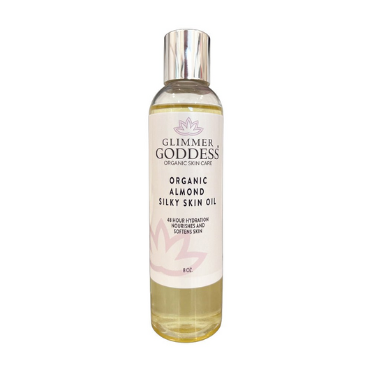 Glimmer Goddess Organic Sweet Almond Silky Skin Oil bottle on a white background, showcasing its premium packaging for 48 hour hydration.