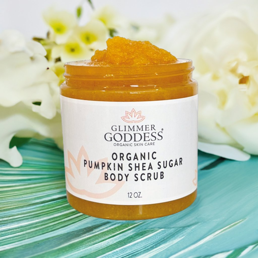 Glimmer Goddess Organic Pumpkin Shea Sugar Body Scrub in a jar, showcasing its vibrant orange exfoliating formula, perfect for fall skincare.