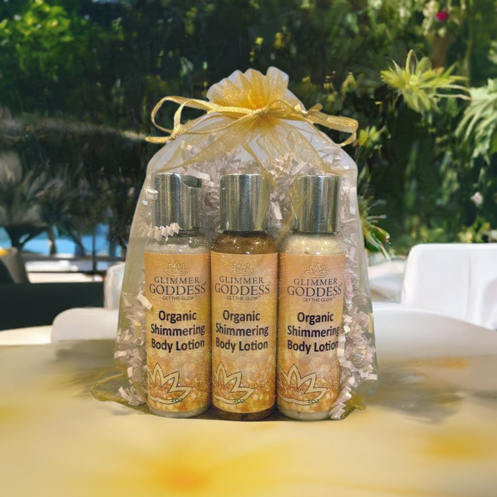 Organic Shimmer Body Lotion Travel Size Gift Set by GNS Beauty & Personal Care, featuring three shimmering body lotions in an elegant gift wrap, surrounded by lush greenery in a luxurious setting.