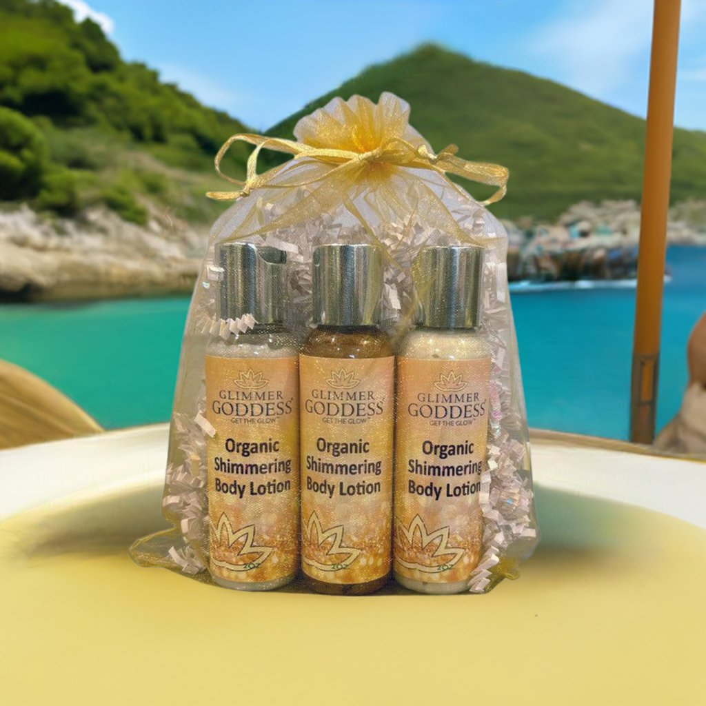 Organic Shimmer Body Lotion Travel Size Gift Set by GNS Beauty & Personal Care, showcasing three shimmering body lotions in travel-sized bottles, presented in a decorative package against a scenic backdrop.
