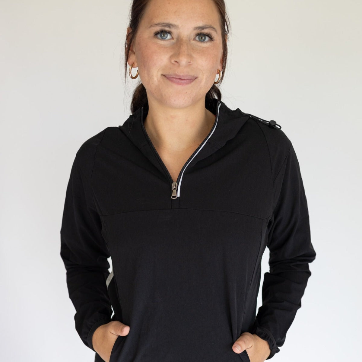 Stylish Women's Hiking Jacket by DYM Athletics in black, showcasing a practical half-zip design, ideal for hiking and casual wear.