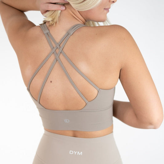 Back view of the Vibe Bra with detailed strappy design by DYM Athletics, showcasing a stylish and supportive fit for medium to high-impact workouts.