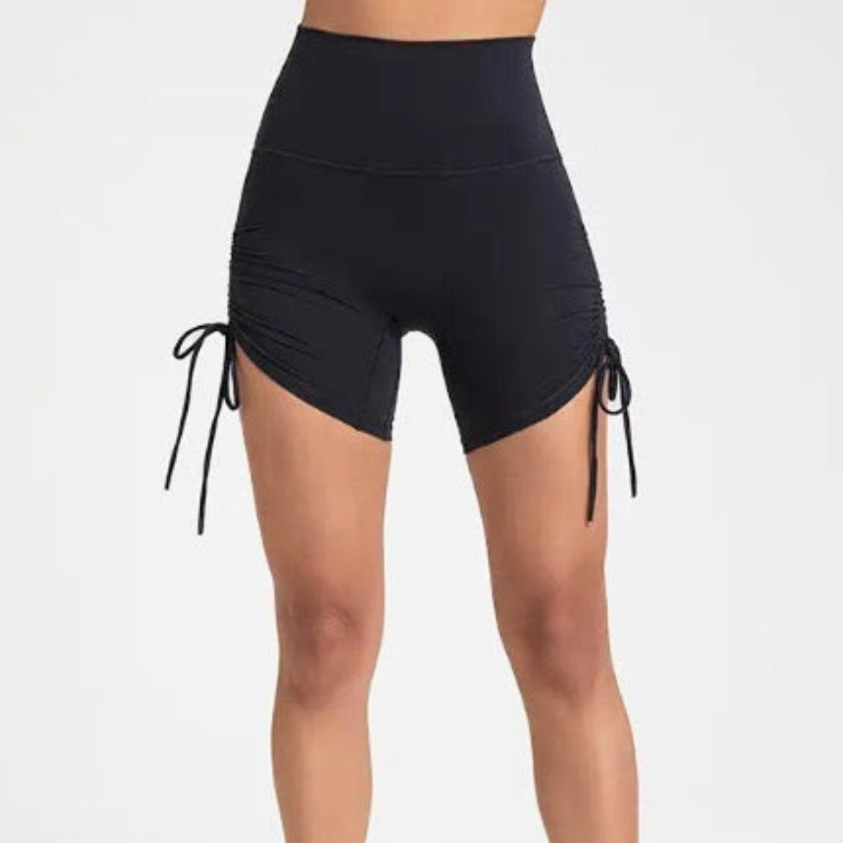 DYM Athletics Ultra-Soft Ruched Biker Shorts designed for comfortable medium to high impact workouts, featuring adjustable side ruching and a flattering fit.