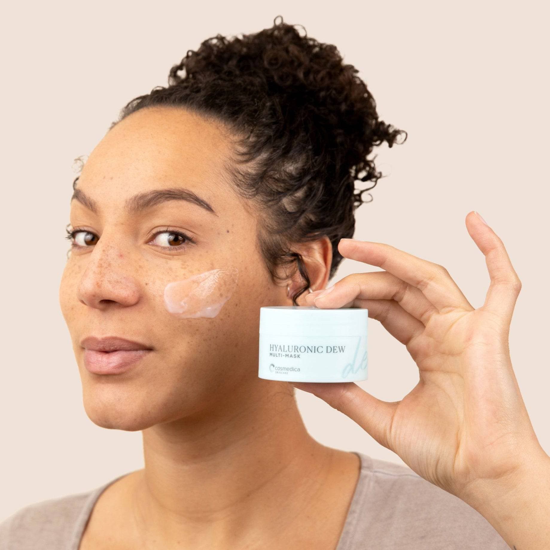 Woman applying Hyaluronic Dew Multi-Mask from Cosmedica Skincare, showcasing the Hydrating Duo in action for radiant skin.