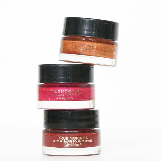 True Moringa Lip Whip Trio Set featuring three stylish lip jars in different shades, perfect for enhancing natural beauty.