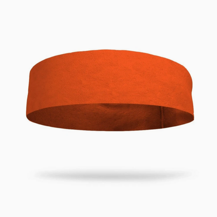 Flat view of the Bondi Band Solid Color Sweat Wicking Workout Headband in bright orange, designed for sweat-wicking and comfort during fitness activities.