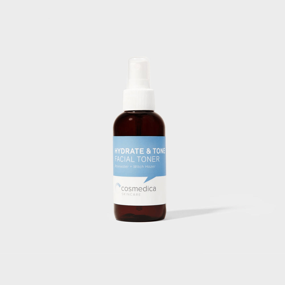 Hydrate & Tone Rosewater Witch Hazel Face Toner by Cosmedica Skincare in a stylish amber spray bottle on a minimalist background.