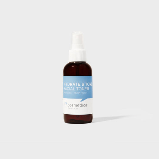 Hydrate & Tone Rosewater Witch Hazel Face Toner by Cosmedica Skincare in a stylish amber spray bottle on a minimalist background.