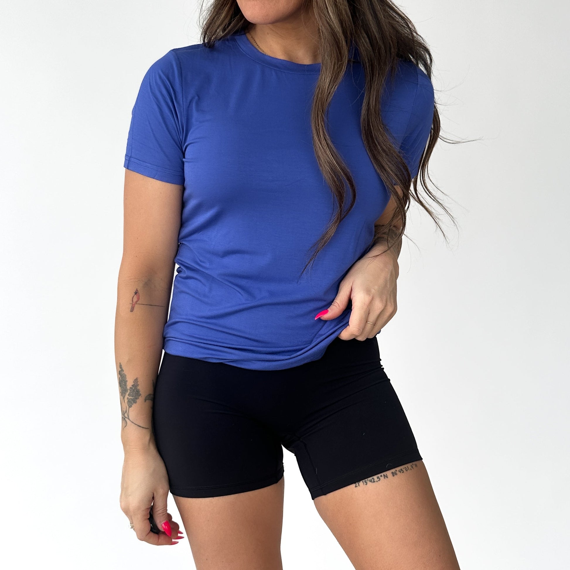 Model wearing the Breathe Bamboo T-Shirt in cool blue by DYM Athletics, ideal for workouts and casual outings.