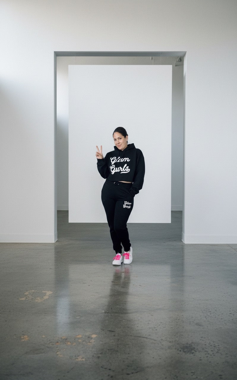 Model giving a peace sign while wearing the Customized Glam Gurls Cropped Hoodie with Puff Print in black, emphasizing the relaxed style perfect for casual wear by Glam Gurls.