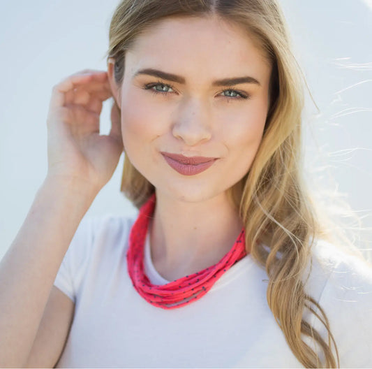 Model showcasing a Bela Band Headband as a chic necklace, highlighting its vibrant color and stylish design by Bela Band.