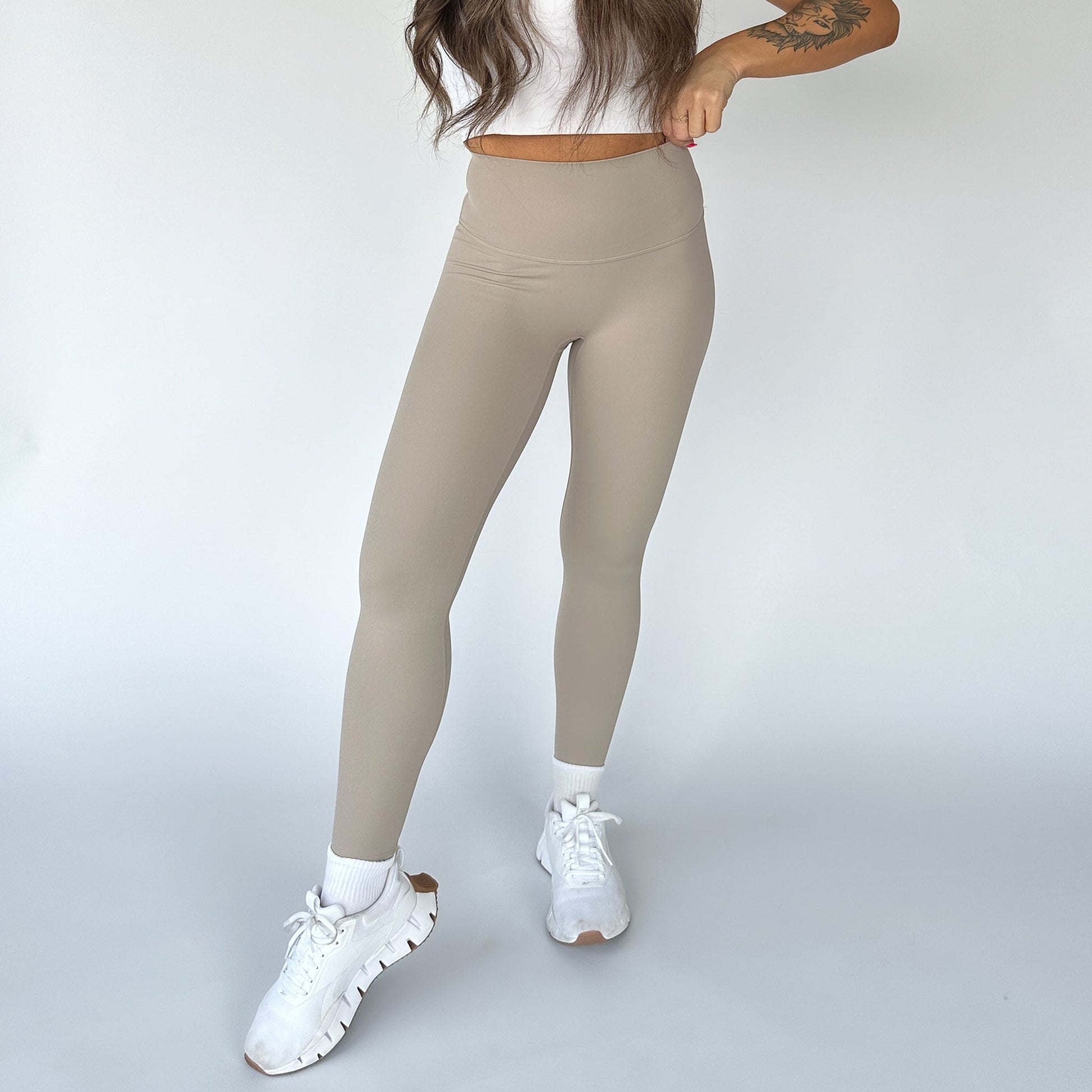 DYM Athletics Buttery Soft Seamless Leggings in light beige, displayed from the front to show the smooth fit and high waist design for a stylish activewear look.