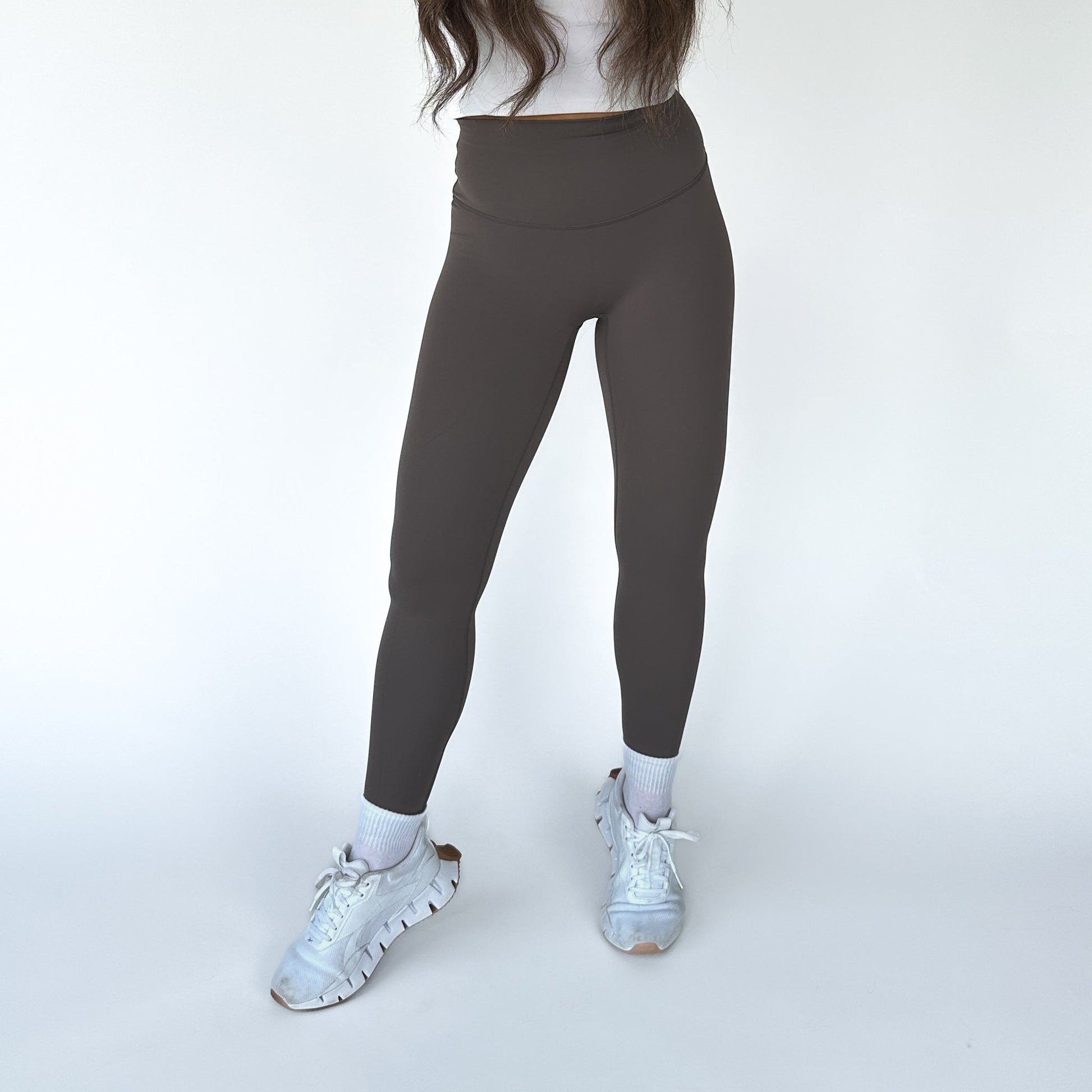 Front view of DYM Athletics Buttery Soft Seamless Leggings in dark brown, emphasizing the high waist and fitted style for maximum comfort during workouts.