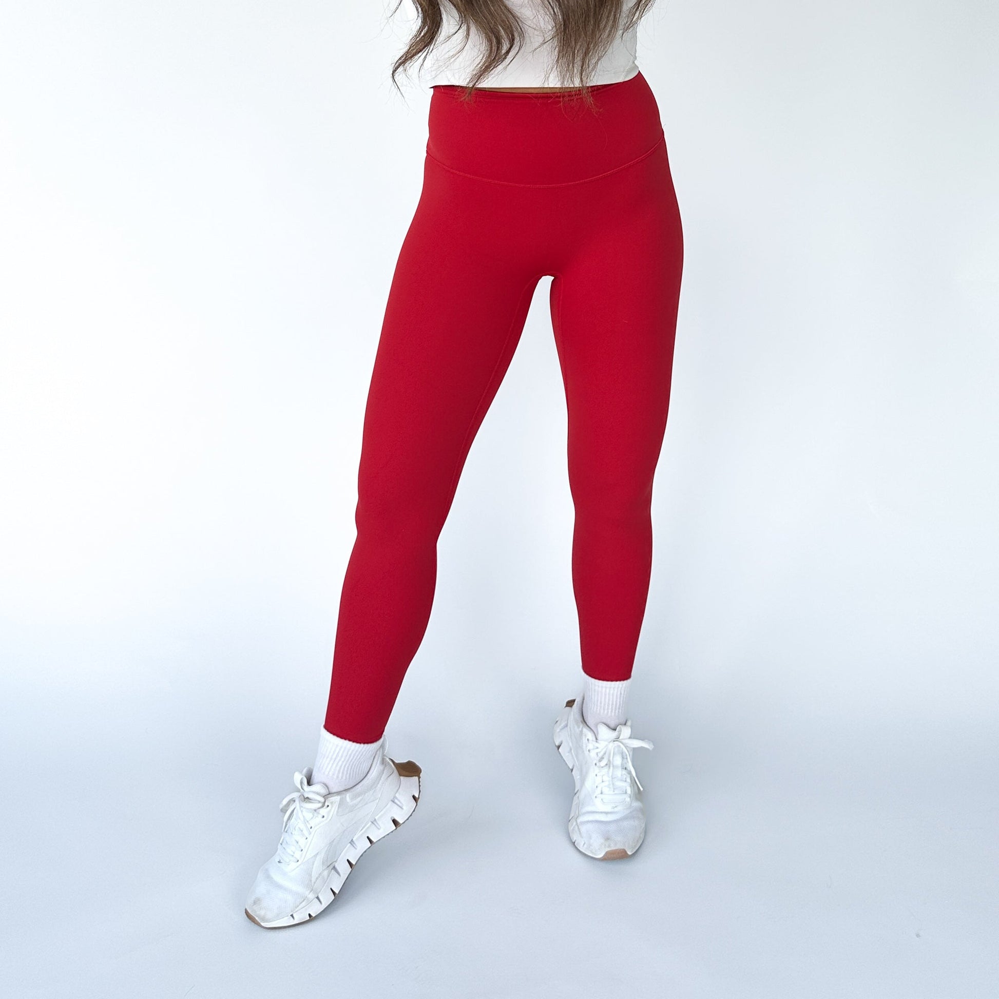 DYM Athletics Buttery Soft Seamless Leggings in vibrant red, providing a sleek and stylish look for active workouts.