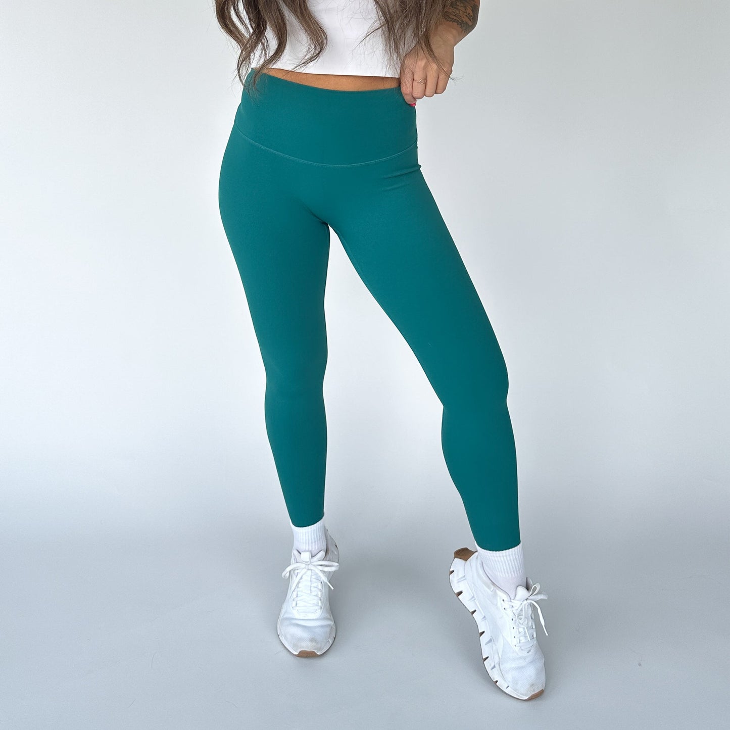 DYM Athletics Buttery Soft Seamless Leggings in teal color, showcasing a fit that's perfect for comfort and support during workouts.