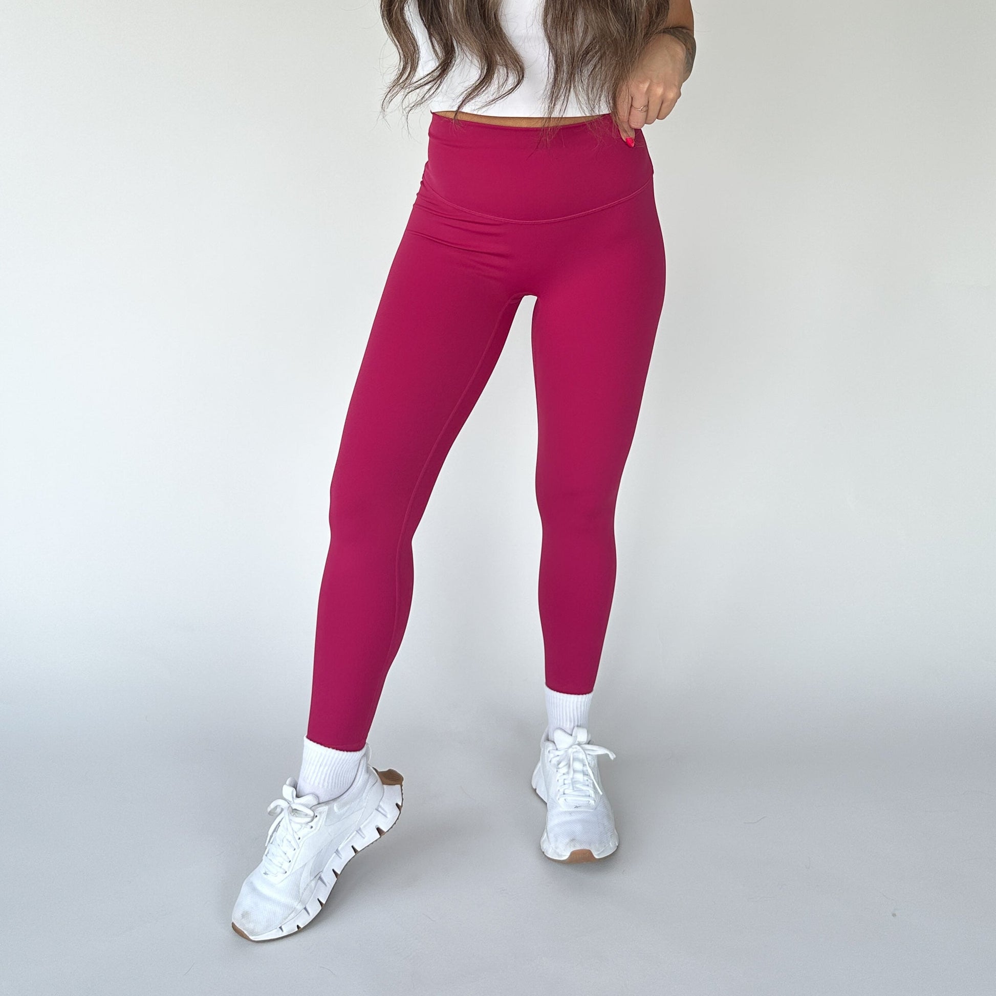 Front view of vibrant pink Buttery Soft Seamless Leggings by DYM Athletics, perfect for activewear with ultimate comfort and support.