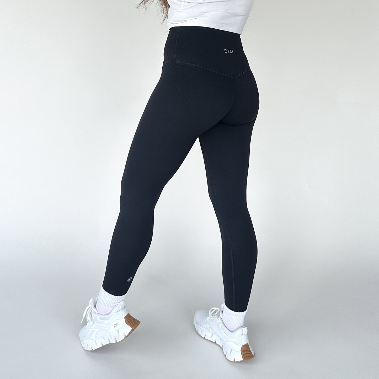 DYM Athletics Buttery Soft Seamless Leggings in black, highlighting the back view with an emphasis on flattering design and support.