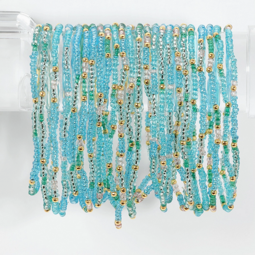 Elegant aqua-colored stretch seed bead bracelet set from Splendid Iris, featuring intricate designs that enhance personal style.