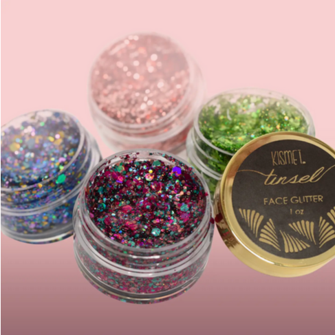 Colorful Go Greek Face Glitter Sets by Stinaface displayed in jars, featuring vibrant shades perfect for sorority events and parties.