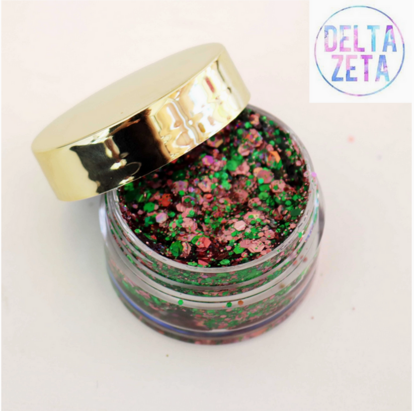 Go Greek Face Glitter Set by Stinaface featuring a festive combination of green and pink glitters in a clear jar, perfect for adding flair to Delta Zeta events.