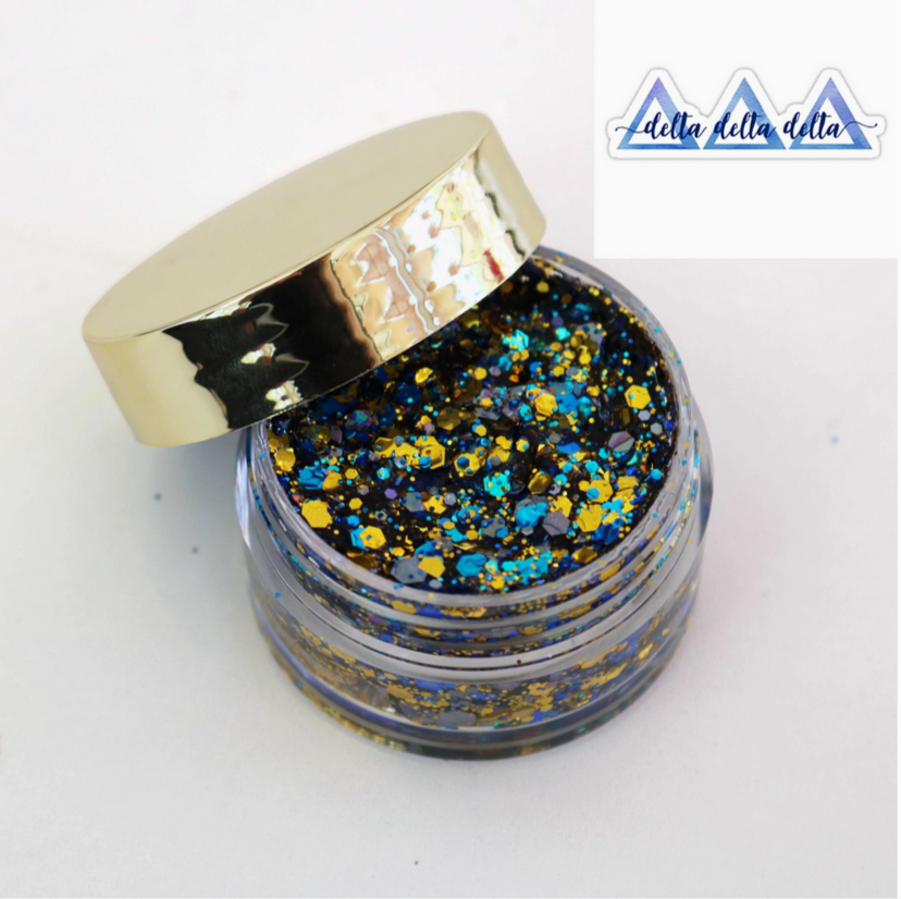 Go Greek Face Glitter Set by Stinaface featuring a vibrant blue and gold glitter mix in a stylish jar, perfect for sorority events.
