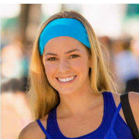Model wearing the Bondi Band Solid Color Sweat Wicking Workout Headband in turquoise, showcasing its stylish and functional design perfect for workouts.