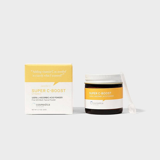 Cosmedica Skincare Super C-Boost Vitamin C powder in a small jar with a box, highlighting its 100% L-Ascorbic Acid formula for brightening the skin.