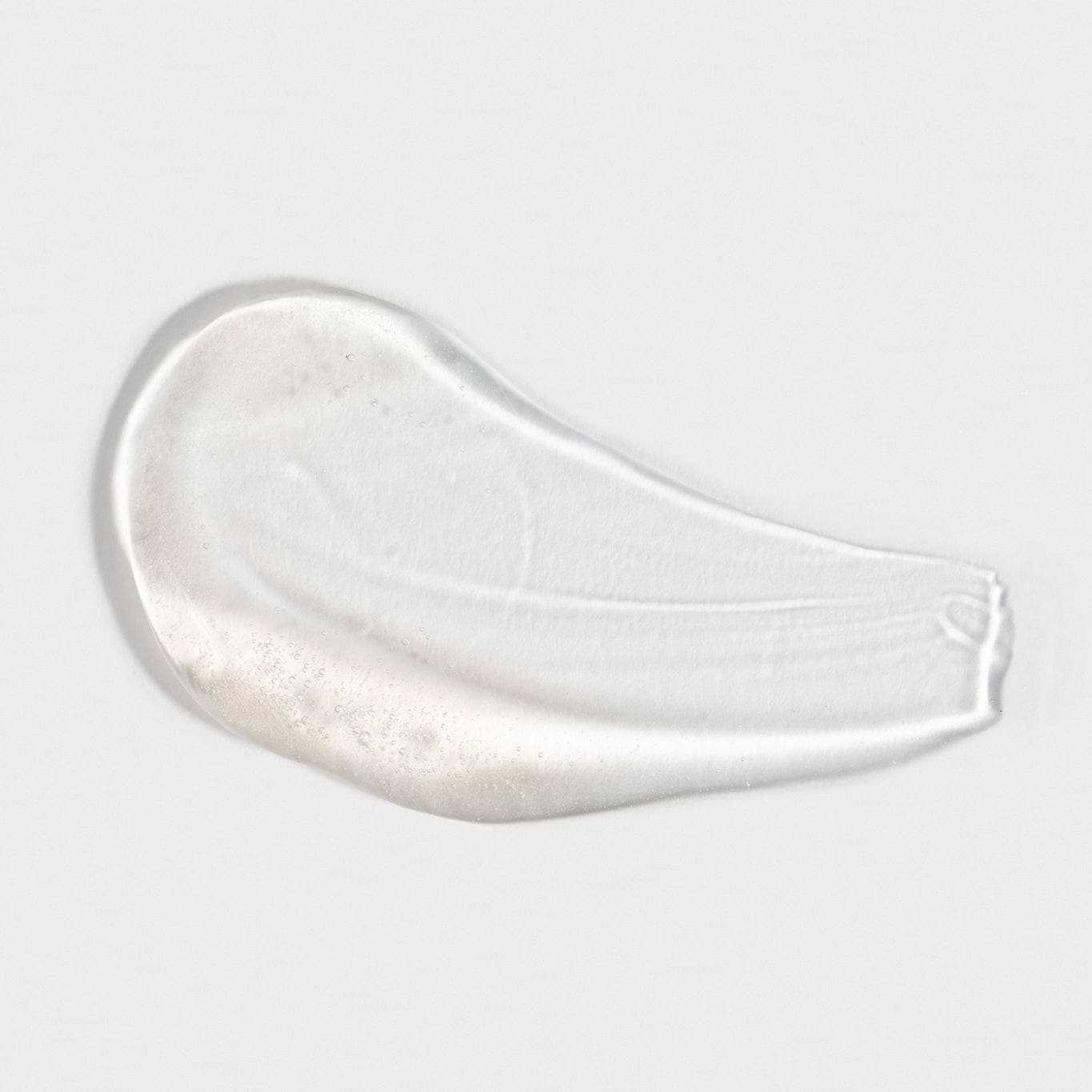 Close-up of a smooth, clear serum texture from the Hyaluronic + Vitamin C Serum Set by Cosmedica Skincare, showcasing its hydrating formula.