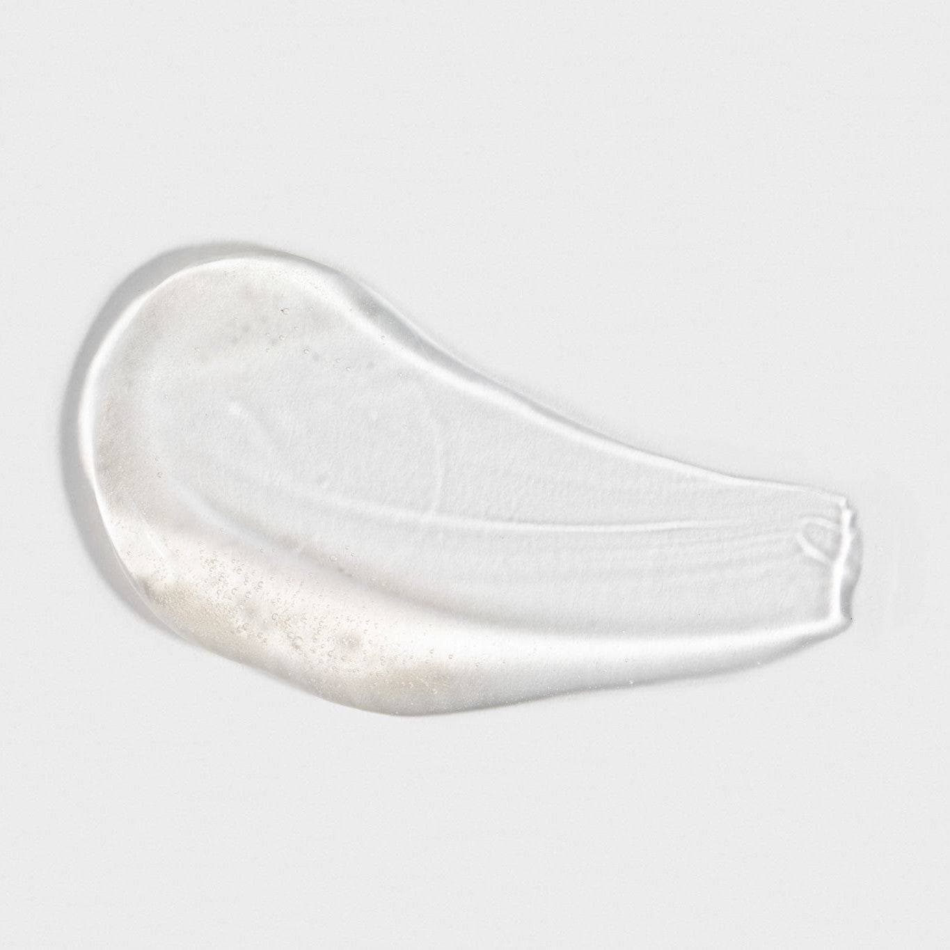 A smooth, clear gel texture of Cosmedica Skincare Vitamin C Super Serum, illustrating its lightweight formula ideal for enhancing skin radiance.